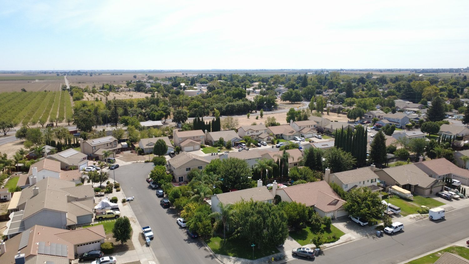 Esparto neighborhood with vineyards beyond